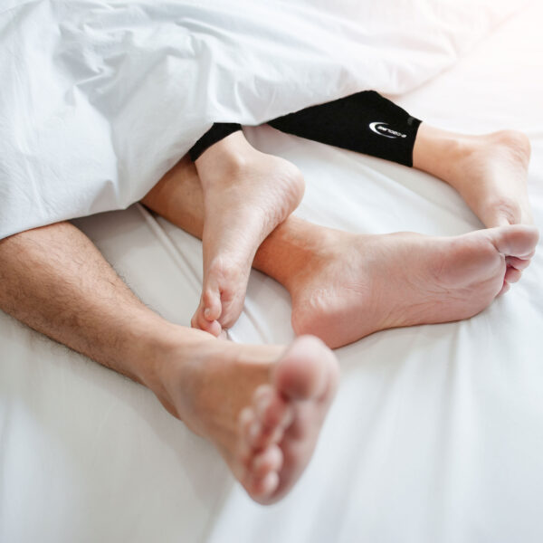 Child wears Young calf cooler and lies in bed