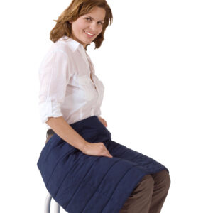 Woman has covered her legs with the cooling blanket from E.COOLINE